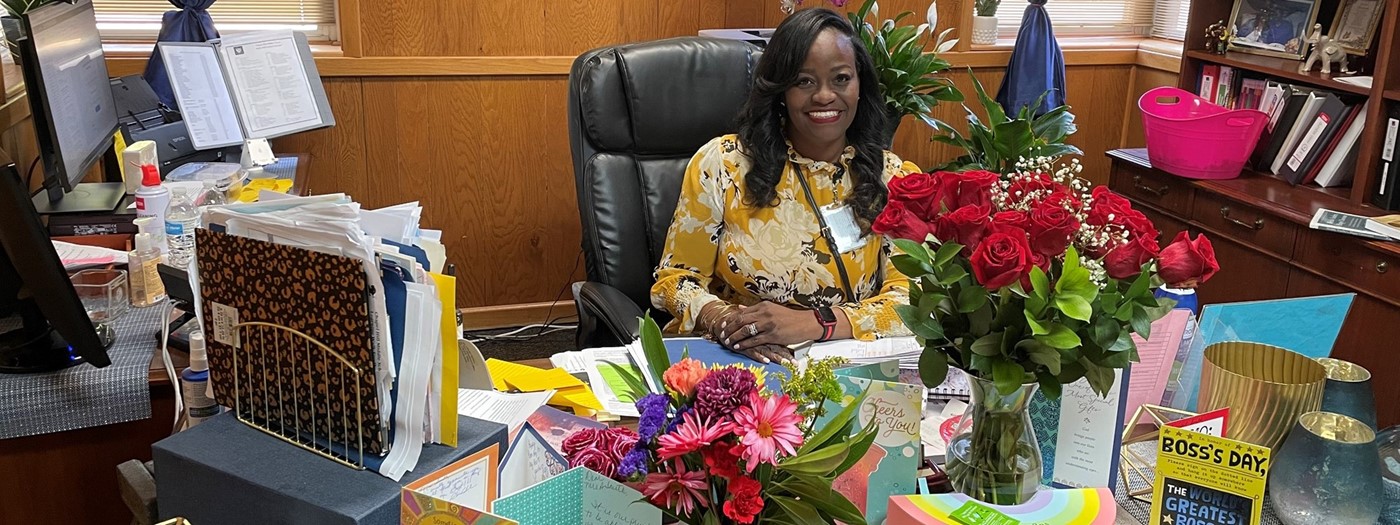 principal smith in her office with gifts on her desk